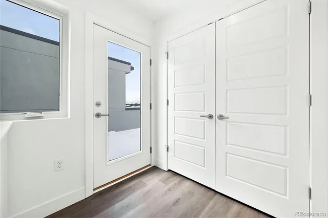 an empty room with wooden floor