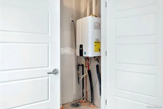 a view of walk in closet with clothes