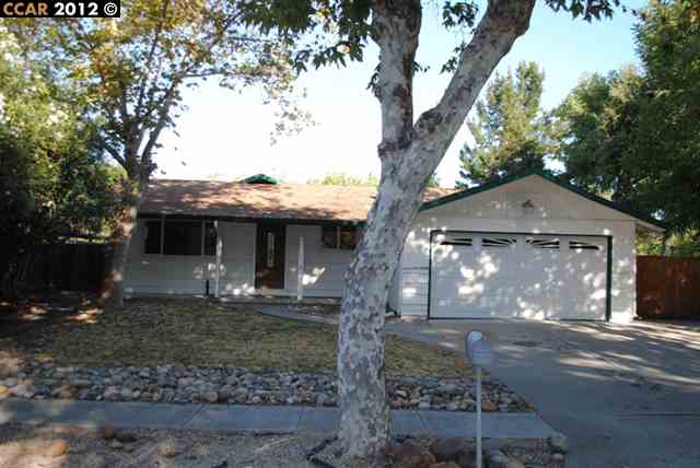 1831 Whitman Road Concord, CA 94518 - Photo 1 of 1 a front view of a house with a yard and garage