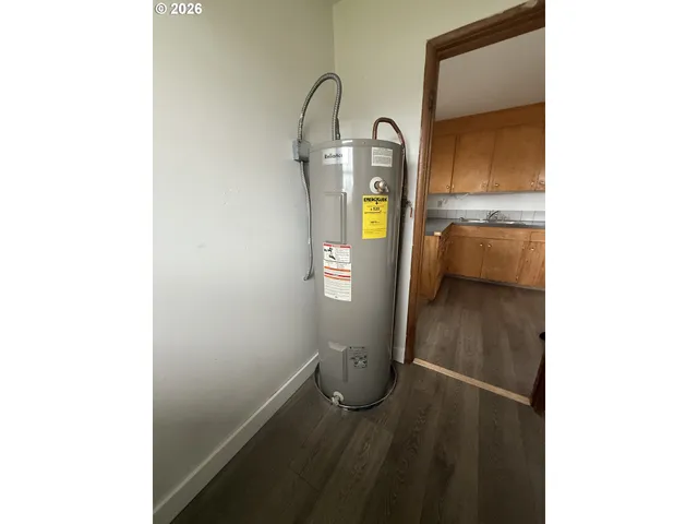 a kitchen with wooden floors and a stove