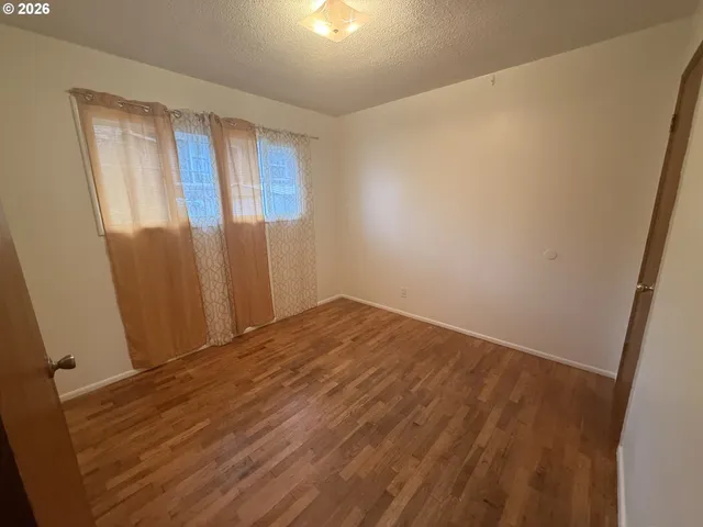 a view of an empty room with windows