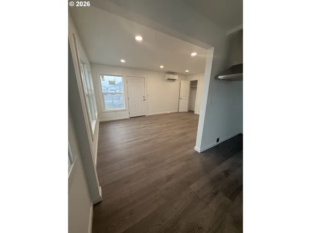 a kitchen with granite countertop a sink and a stove