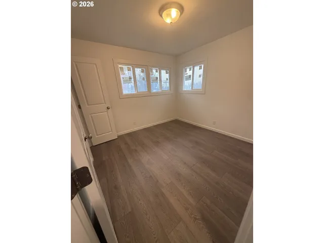 a view of an empty room with a window