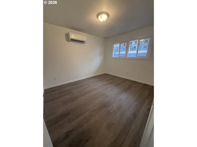 a white toilet sitting next to a bathroom sink and a tub