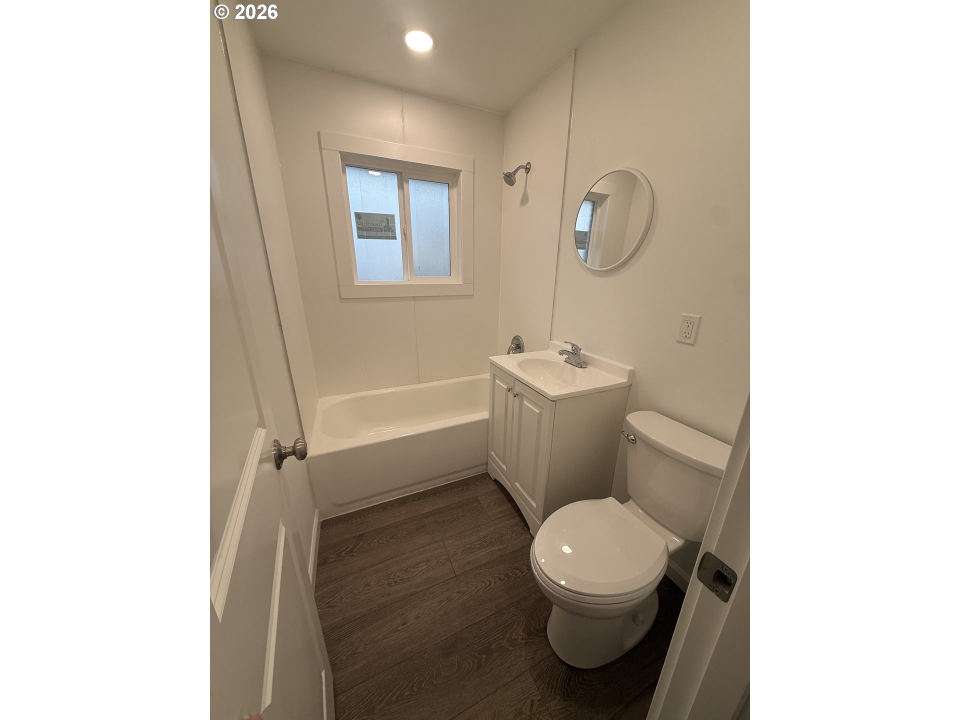 805 Southeast 6th Street Pendleton, OR 97801 - Photo 31 of 32 a white toilet sitting next to a bathroom sink and a tub