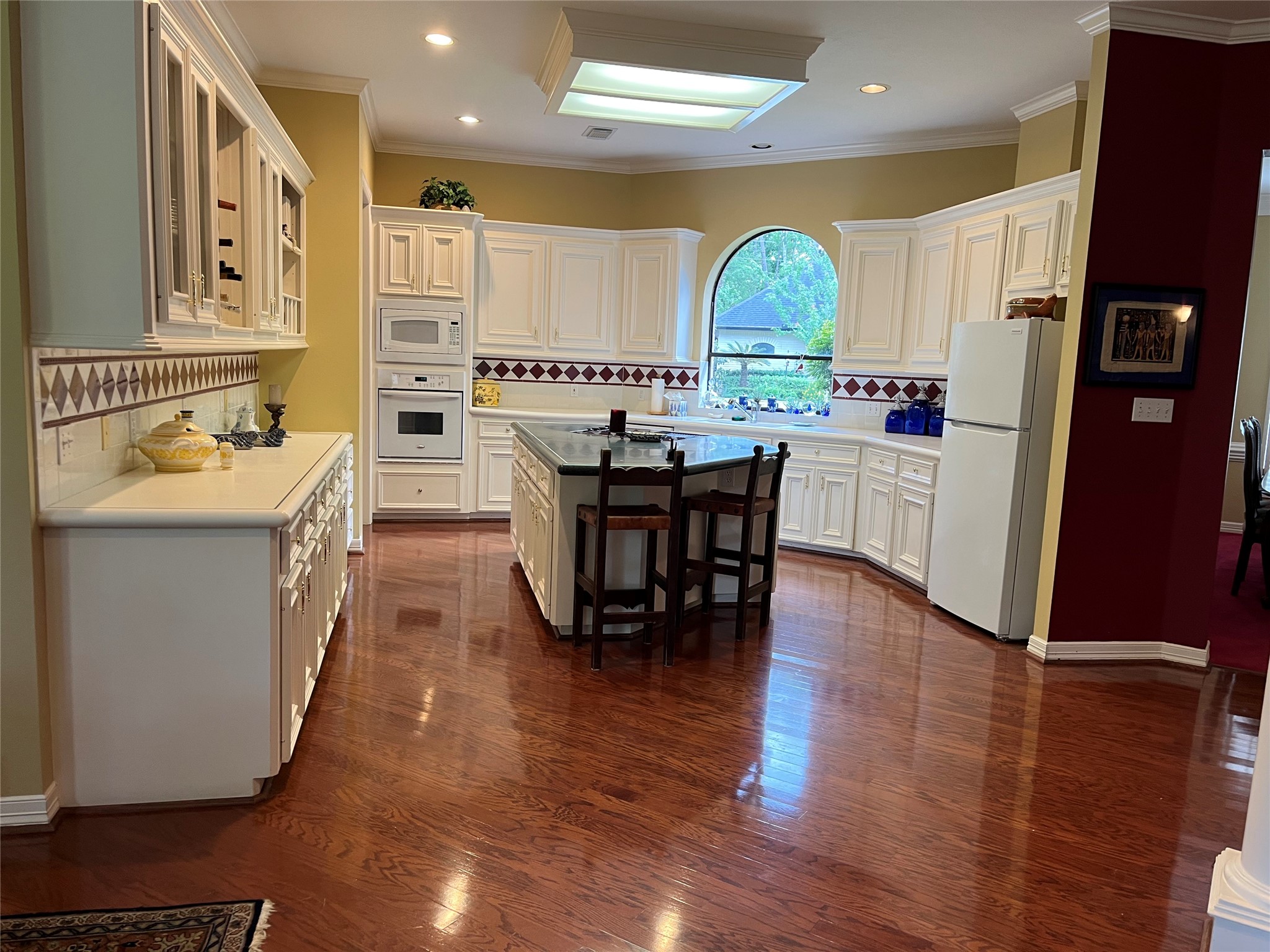 24602 West Kingscrest Circle Spring, TX 77389 - Photo 6 of 20 a kitchen with stainless steel appliances granite countertop a table and chairs in it