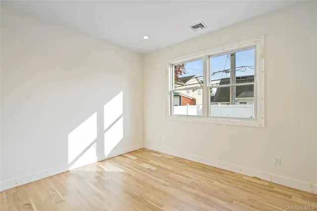 a large kitchen with stainless steel appliances kitchen island granite countertop a sink and cabinets