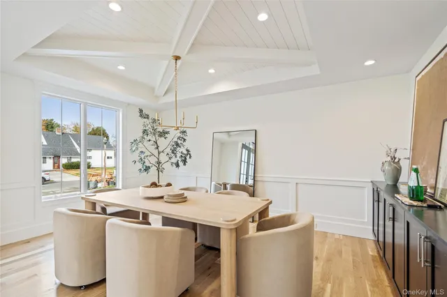 a dining room with a table and chairs