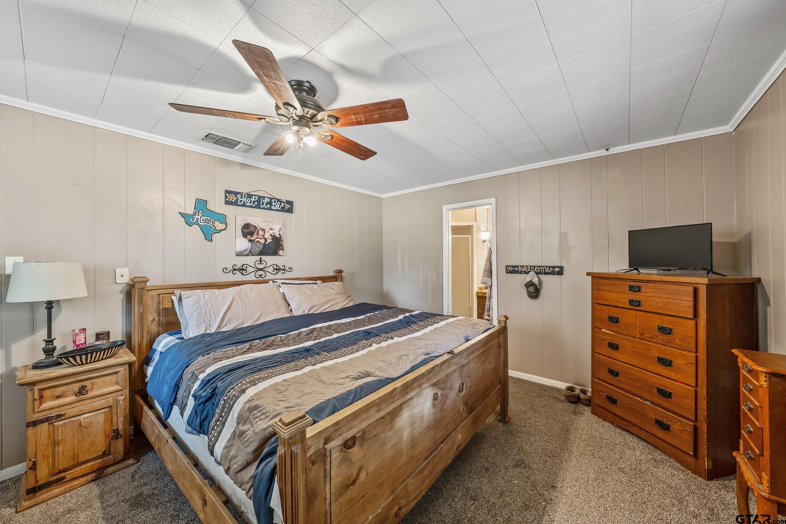 271 Nottingham Rusk, TX 75785 - Photo 12 of 23 a bed room with a bed and a ceiling fan