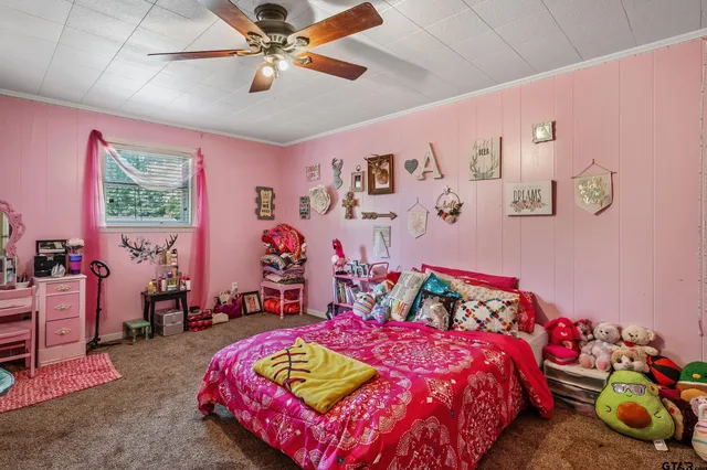 a bedroom with a bed and a table