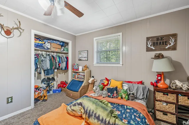 a bed room with a bed and a window