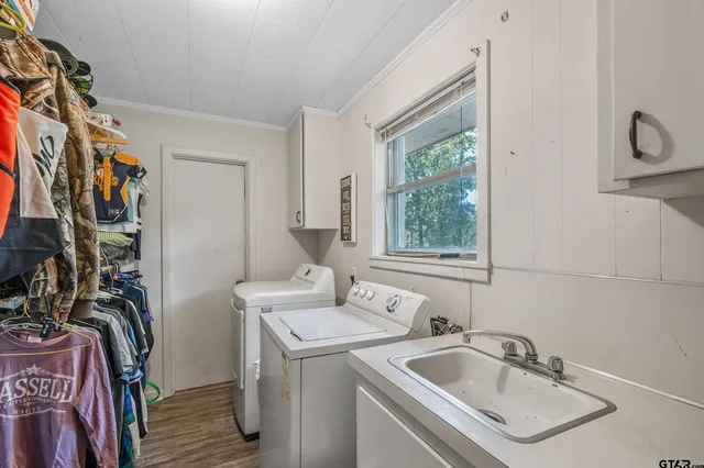 a bathroom with a sink and a window