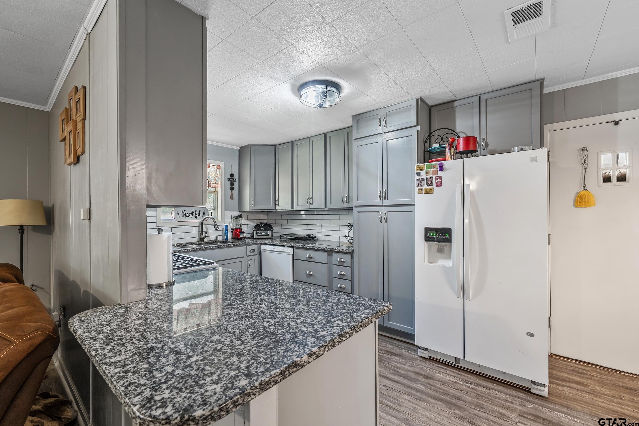 271 Nottingham Rusk, TX 75785 - Photo 4 of 23 a kitchen with refrigerator and cabinets