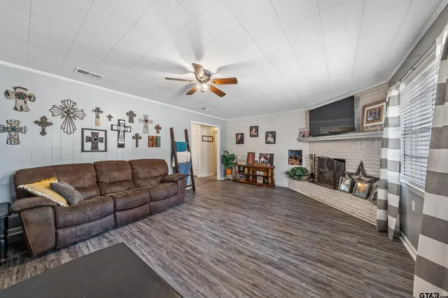 a living room with furniture and a fireplace