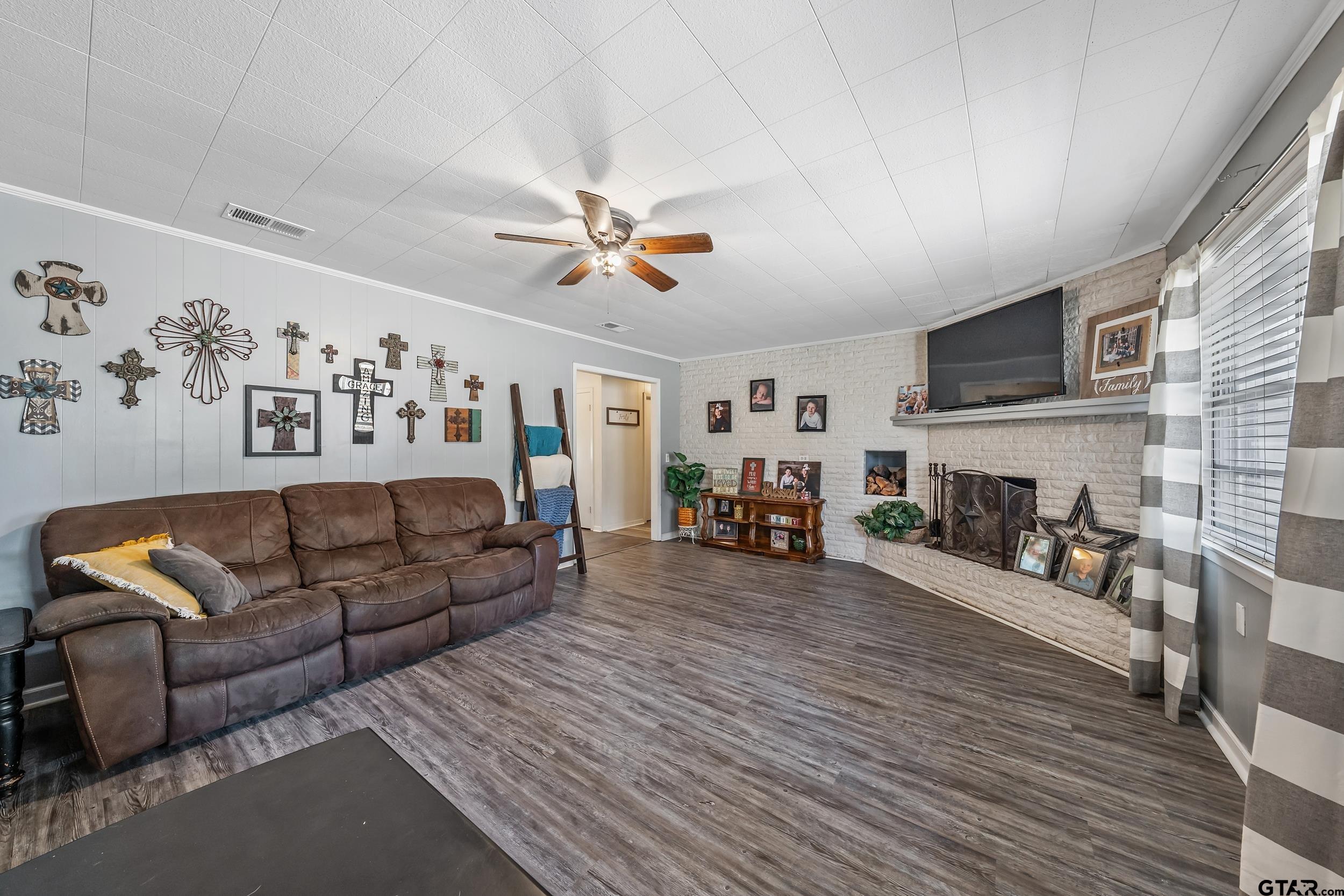 271 Nottingham Rusk, TX 75785 - Photo 10 of 23 a living room with furniture and a fireplace