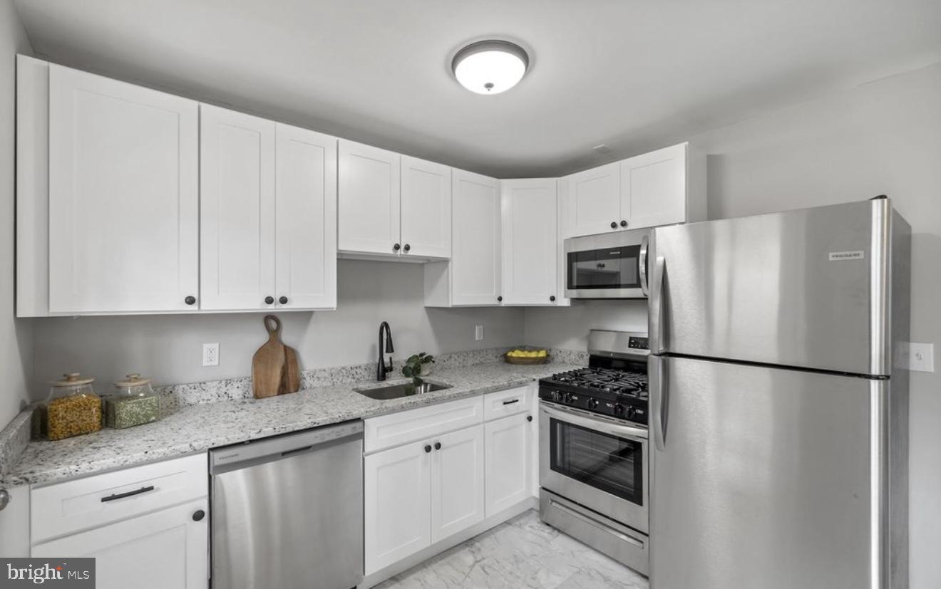 243 Highmeadow Road Reisterstown, MD 21136 - Photo 17 of 32 Modern kitchen with sleek finishes.