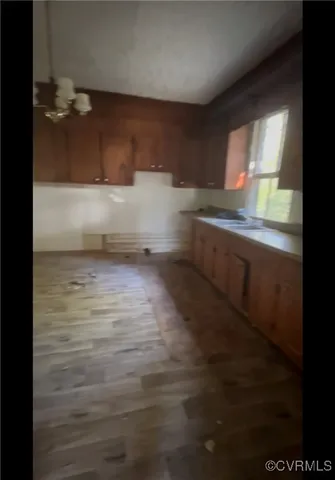 a view of kitchen and wooden floor