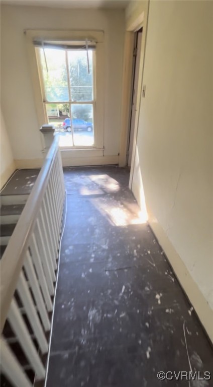 10618 Rives Avenue McKenney, VA 23872 - Photo 8 of 10 a view of an empty room with wooden floor and windows