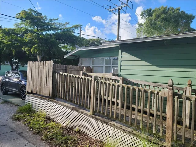 a view of a wooden fence