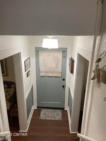 a view of a hallway with windows