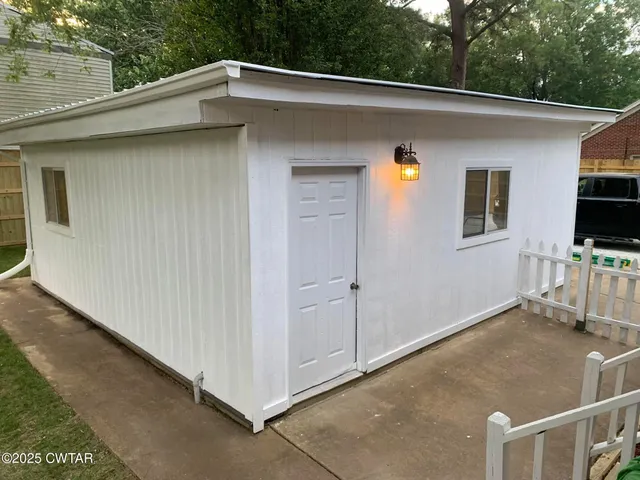 a backyard of a house with seating space