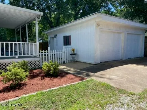 a backyard of a house with a garden and deck