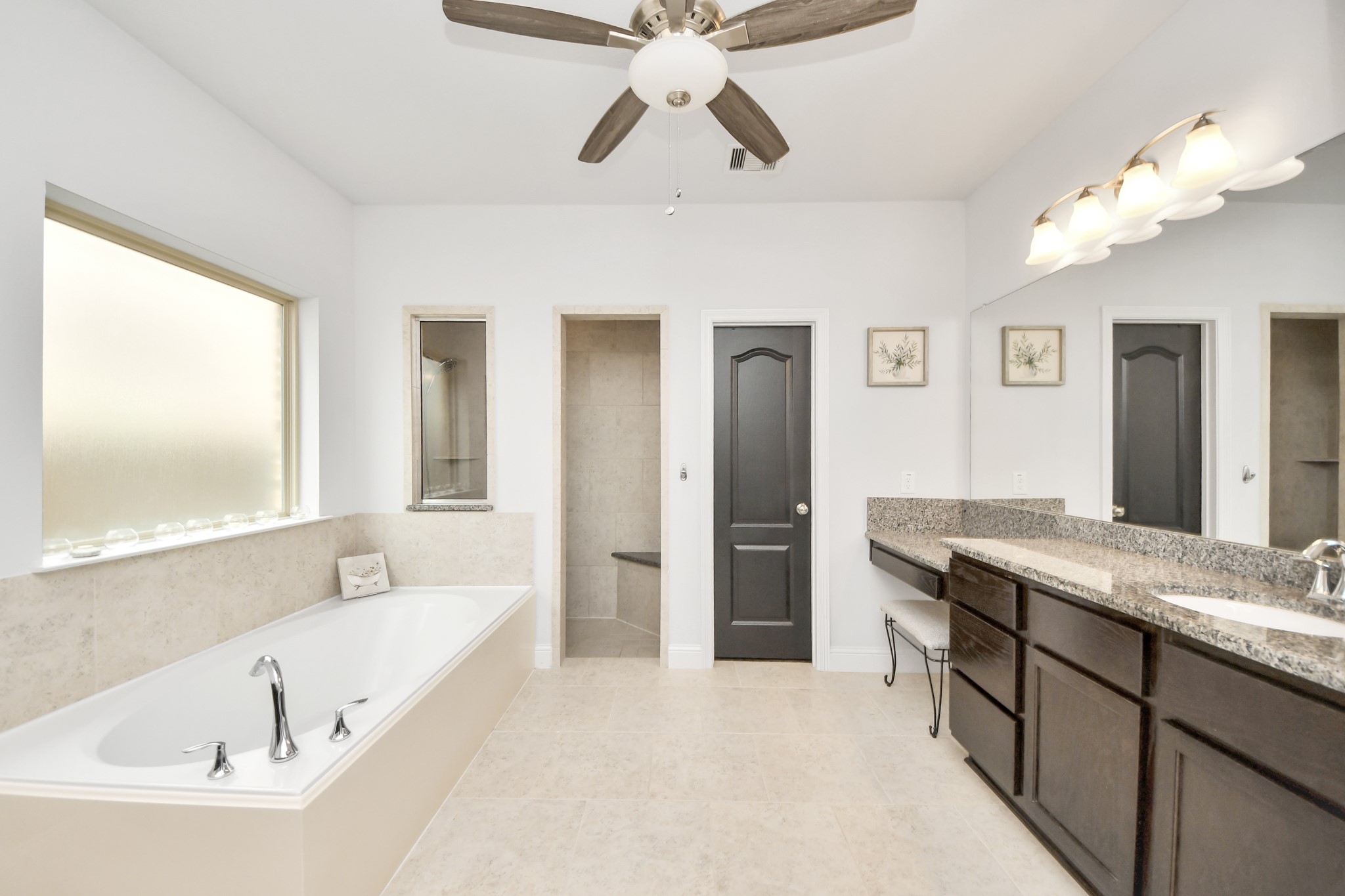 2811 Hadley Springs Lane Spring, TX 77386 - Photo 21 of 50 a spacious bathroom with a granite countertop tub sink and mirror