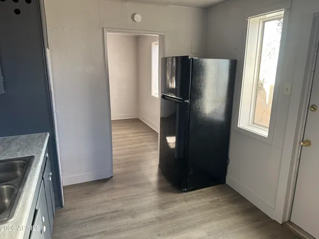 a kitchen with metallic refrigerator freezer and a dishwasher