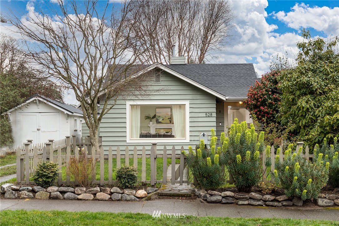 528 North 74th Street Seattle, WA 98103 - Photo 1 of 34 a front view of a house with a yard