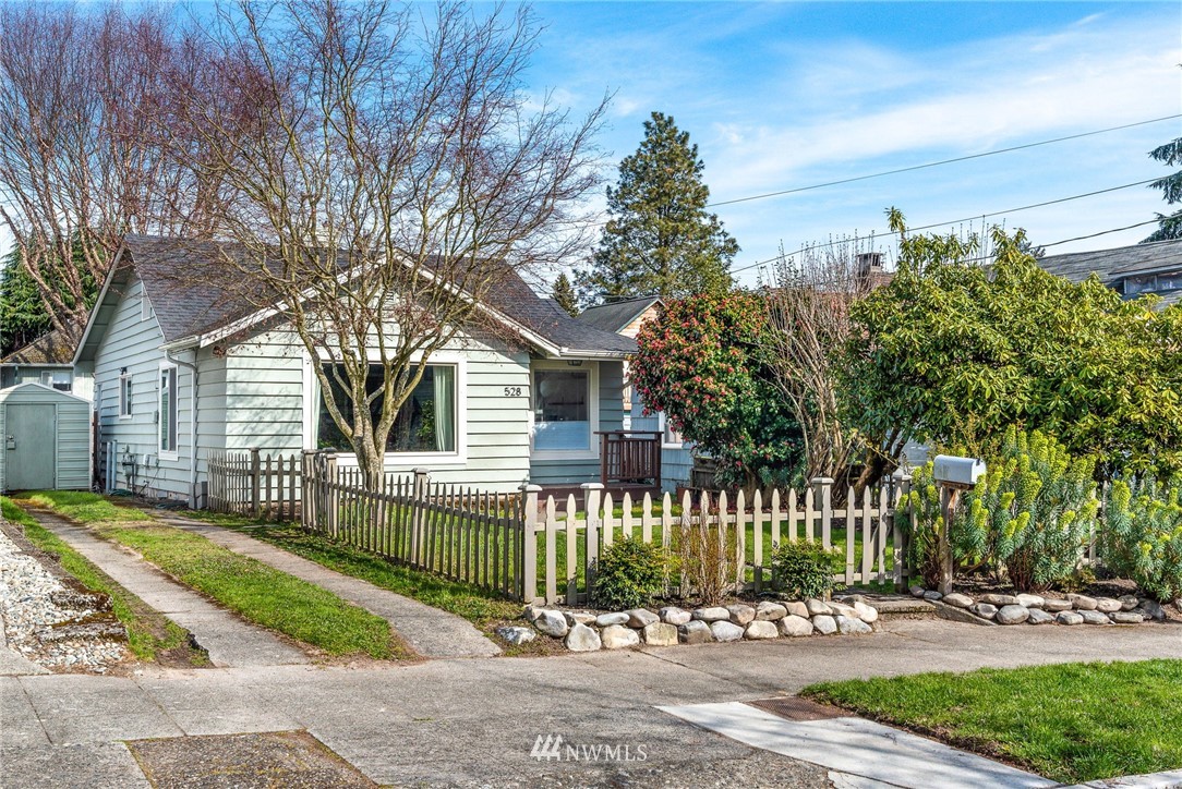 528 North 74th Street Seattle, WA 98103 - Photo 3 of 34 a front view of a house with a garden and plants