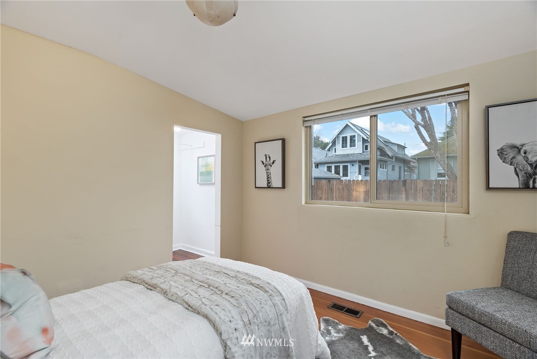 528 North 74th Street Seattle, WA 98103 - Photo 28 of 34 a bedroom with a bed and a window