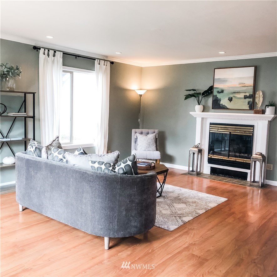 528 North 74th Street Seattle, WA 98103 - Photo 6 of 34 a living room with furniture and a fireplace