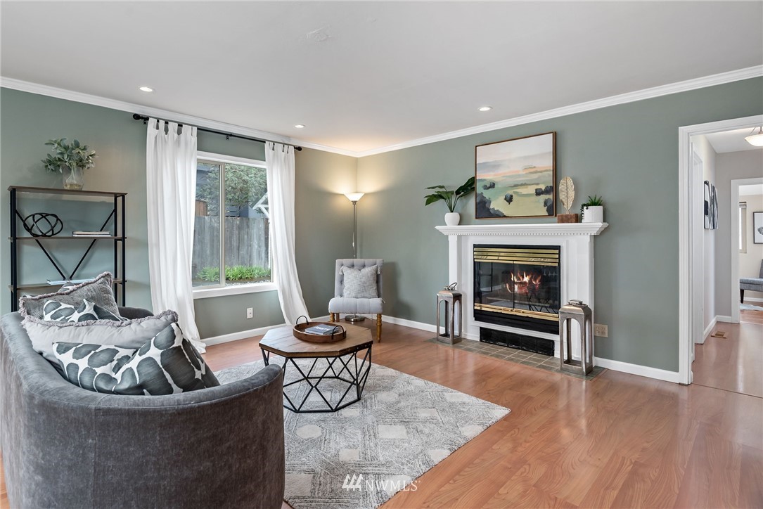 528 North 74th Street Seattle, WA 98103 - Photo 9 of 34 a living room with furniture and a fireplace