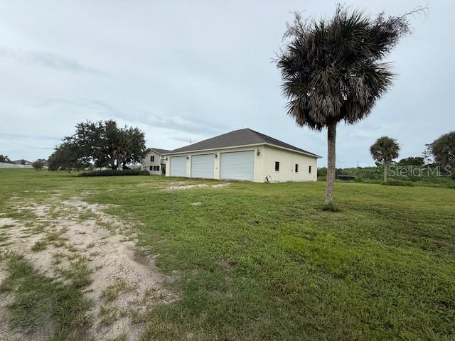 1799 East Manasota Beach Road Englewood, FL 34223 - Photo 11 of 50 a view of a house with a yard