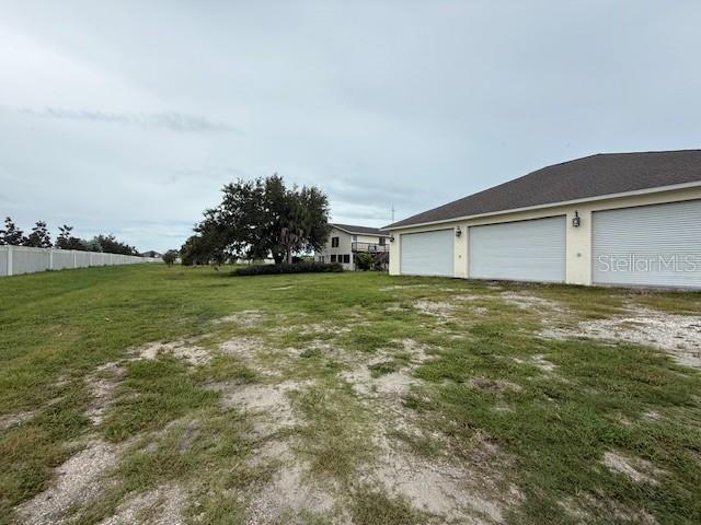 1799 East Manasota Beach Road Englewood, FL 34223 - Photo 12 of 50 a view of a house with a big yard
