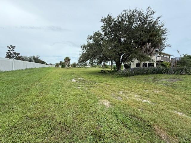 1799 East Manasota Beach Road Englewood, FL 34223 - Photo 13 of 50 a view of a field of grass and trees