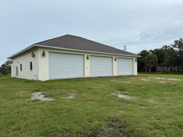 1799 East Manasota Beach Road Englewood, FL 34223 - Photo 14 of 50 a front view of house with garden