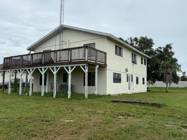 1799 East Manasota Beach Road Englewood, FL 34223 - Photo 26 of 50 a front view of a house with a yard