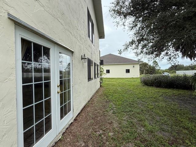 1799 East Manasota Beach Road Englewood, FL 34223 - Photo 29 of 50 a view of a house with a yard