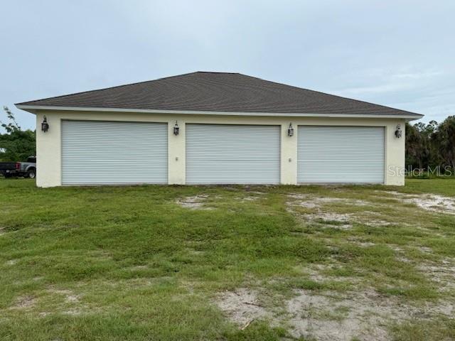 1799 East Manasota Beach Road Englewood, FL 34223 - Photo 4 of 50 a house that has a small yard