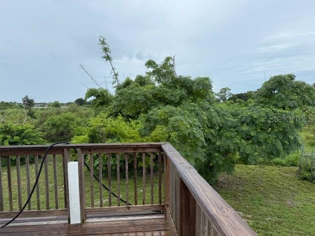 1799 East Manasota Beach Road Englewood, FL 34223 - Photo 42 of 50 a view of balcony with yard and deck