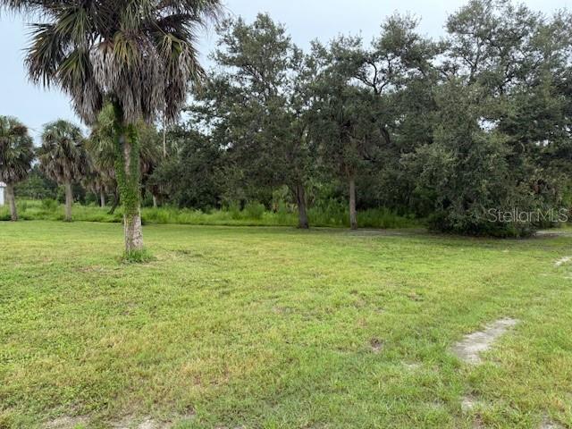 1799 East Manasota Beach Road Englewood, FL 34223 - Photo 45 of 50 a view of outdoor space with deck and yard