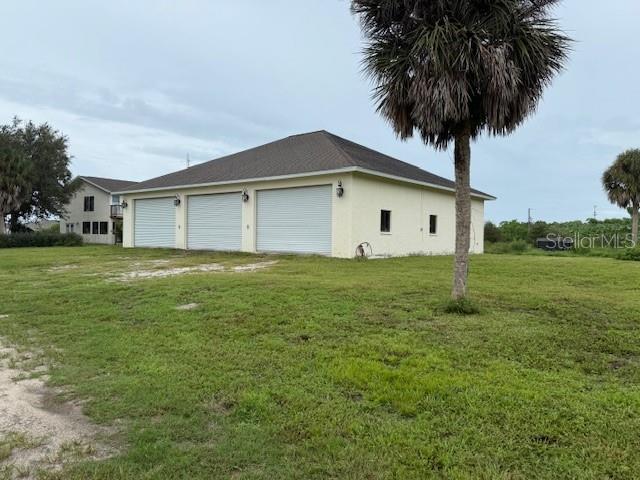 1799 East Manasota Beach Road Englewood, FL 34223 - Photo 5 of 50 a house with yard in front of it