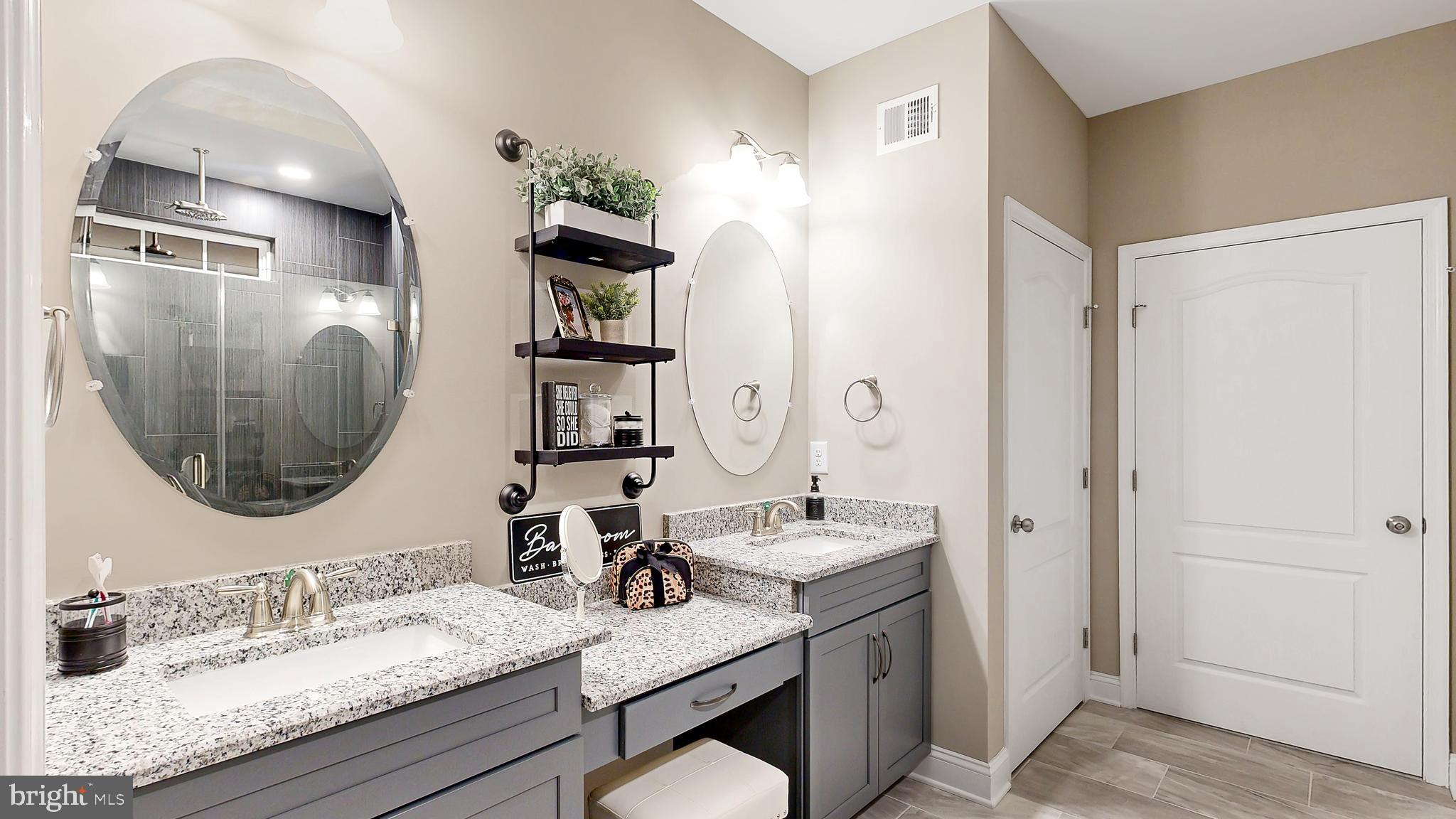 8 Antlered Way Georgetown, DE 19947 - Photo 16 of 19 a bathroom with a granite countertop sink mirror and vanity