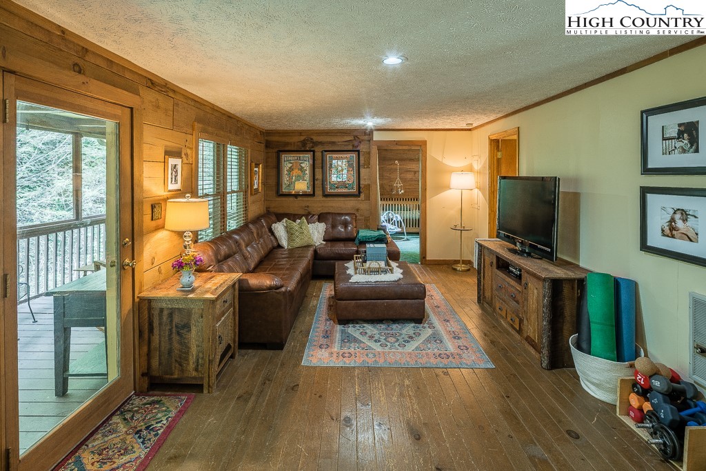166 Mountain Ivy Lane Boone, NC 28607 - Photo 11 of 23 a living room with furniture and a flat screen tv