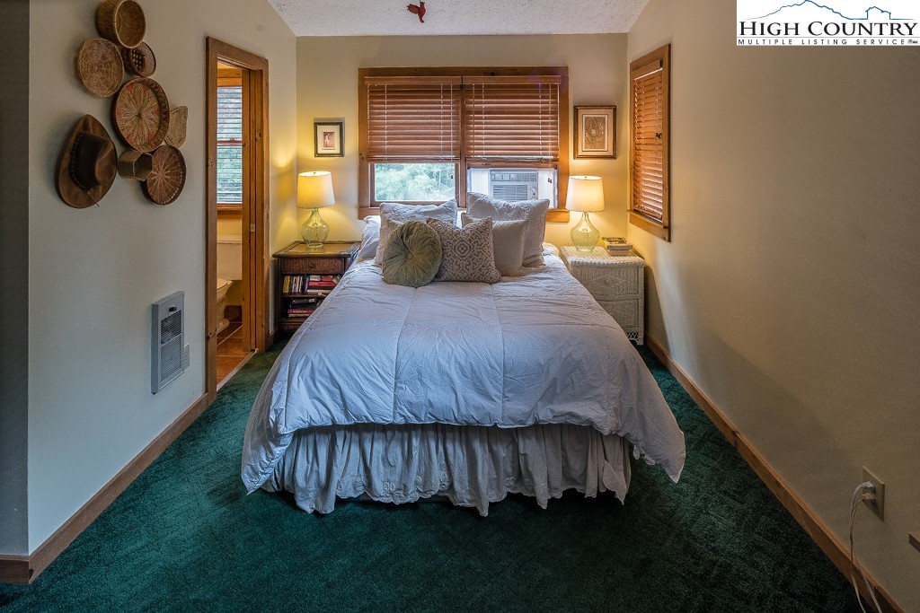 166 Mountain Ivy Lane Boone, NC 28607 - Photo 15 of 23 a bedroom with a bed and window
