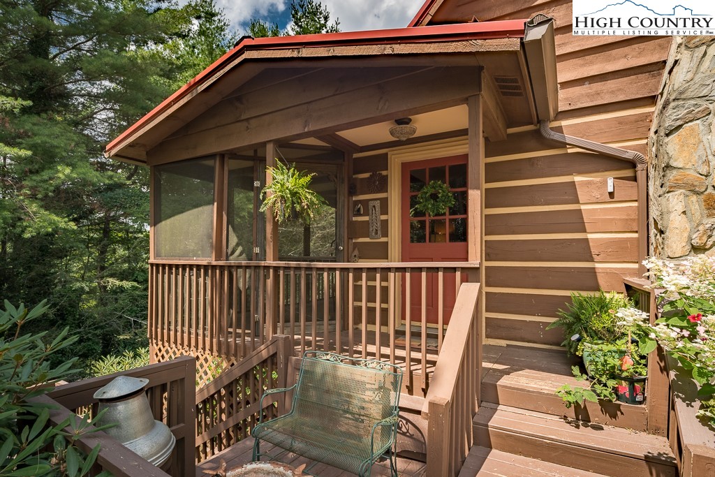 166 Mountain Ivy Lane Boone, NC 28607 - Photo 2 of 23 a view of a chair and table in the balcony