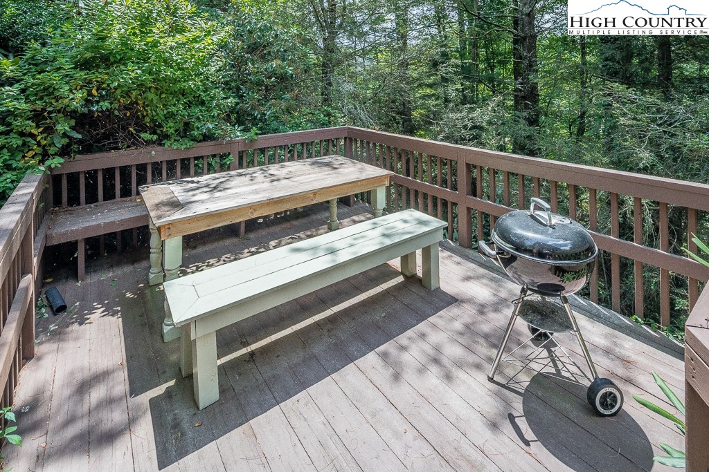 166 Mountain Ivy Lane Boone, NC 28607 - Photo 21 of 23 a view of a roof deck with wooden floor and barbeque oven