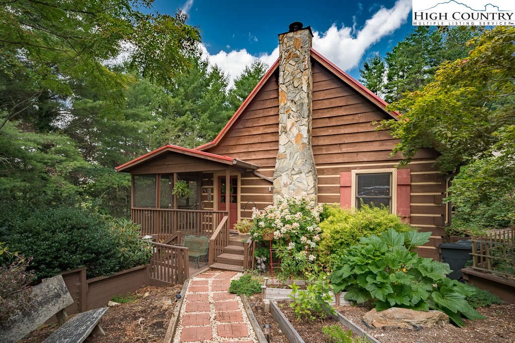 166 Mountain Ivy Lane Boone, NC 28607 - Photo 23 of 23 a view of a small house with a yard