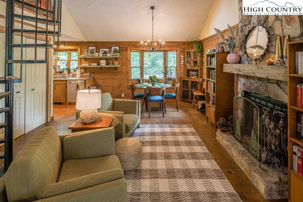 166 Mountain Ivy Lane Boone, NC 28607 - Photo 3 of 23 a living room with patio furniture and a fireplace
